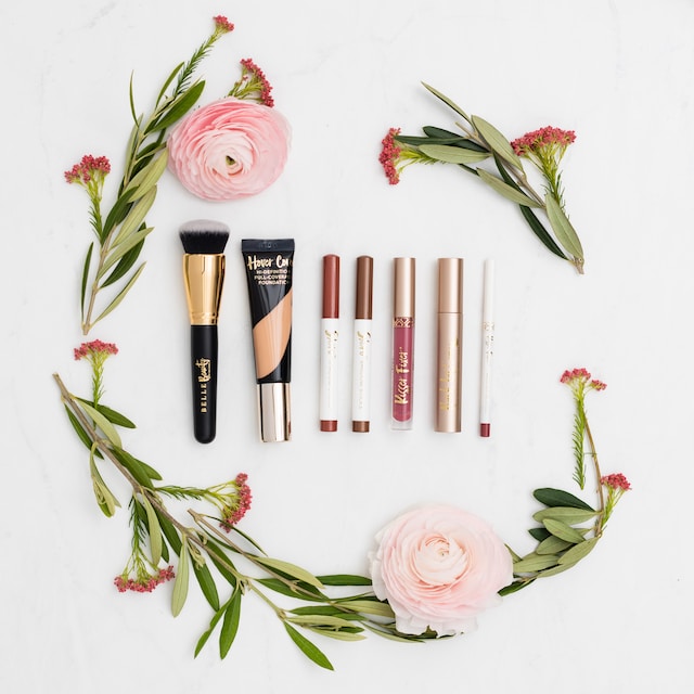 Cosmetics laid out with flowers
